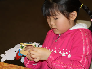 girl making paper model