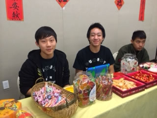 student volunteers at the food table