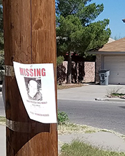 missing person poster on telephone pole