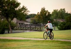 Man Riding Bike on Trail