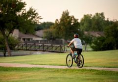 Man riding bike on trail