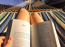 woman reading in hammock