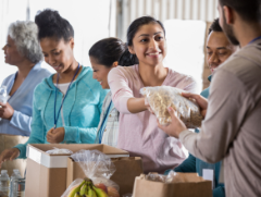 Group of volunteers handing out food