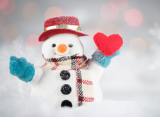 Snowman holding red heart