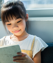 girl reading an Early Chapter Book