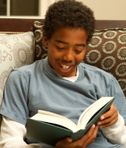 boy reading a Juvenile Fiction book