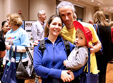 Father, Mother, and Child at Citizens Evening