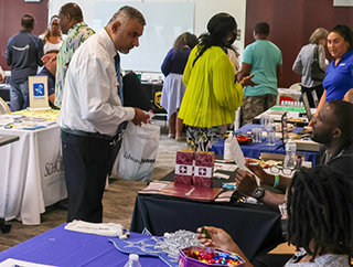 Job Fair participants talking to employers