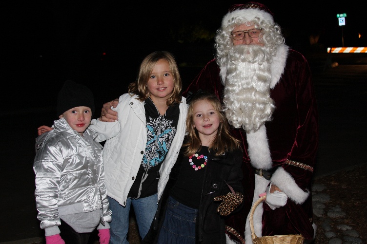 Three girls with Santa.