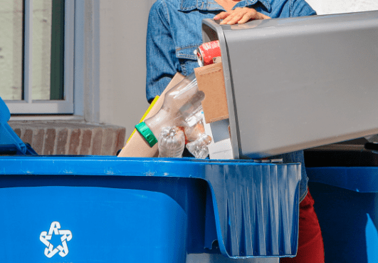 woman-recycling-outdoors-bin-container-min