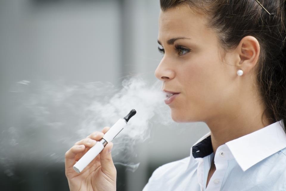 Woman smoking e-cig